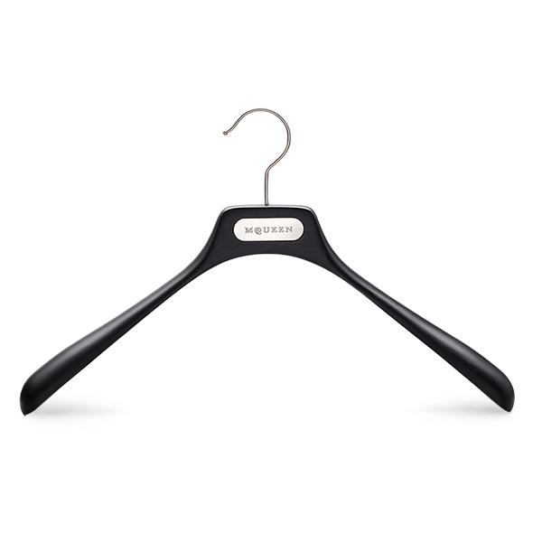 Black wooden clothes hanger with metal hook and branded plaque